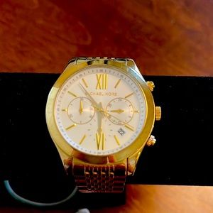 Gold Michael kors watch.